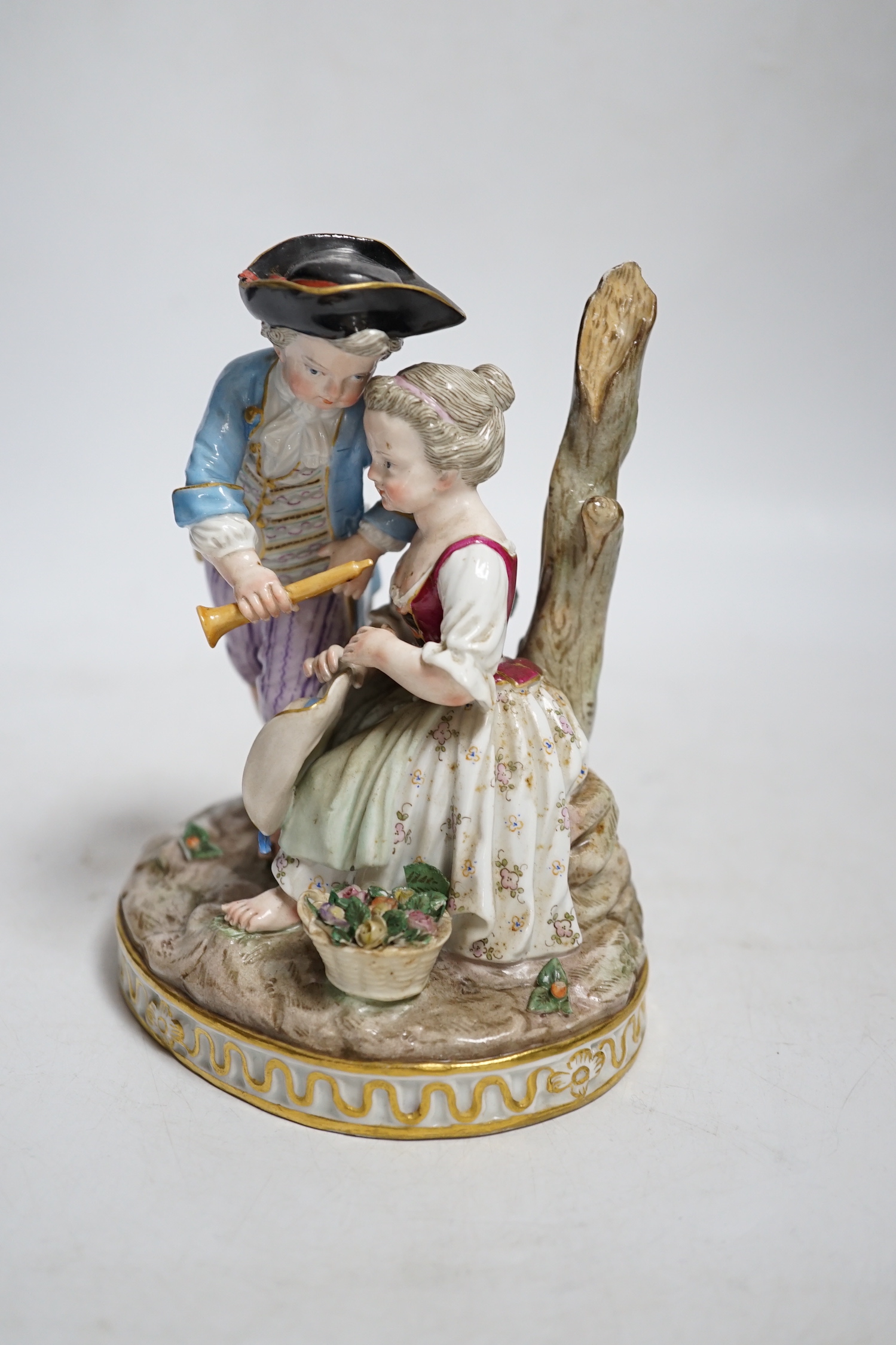 A Meissen group of a boy and a girl with a piccolo, 19th century